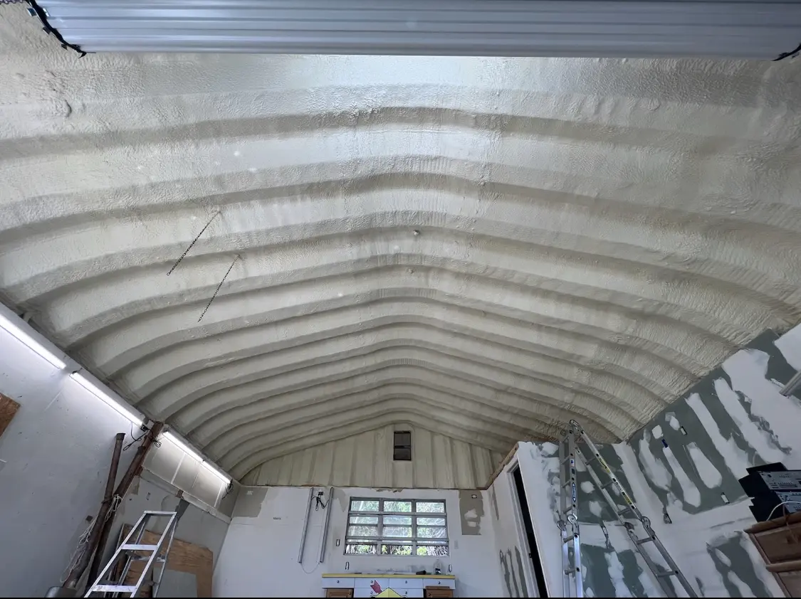 Spray polyurethane foam applied to the underside of a metal roof deck in Lancaster
